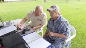 Bill KR4LO assists event attendee, Joy McCracken, with her first radio contact.