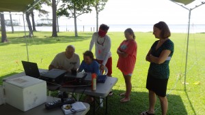 Bill KR4LO provides more instruction on amateur radio use to a youngster with her first radio transmission. Was she excited!